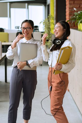 Colleagues laughing during a workshop — photo by Mikhail Nilov on Pexels