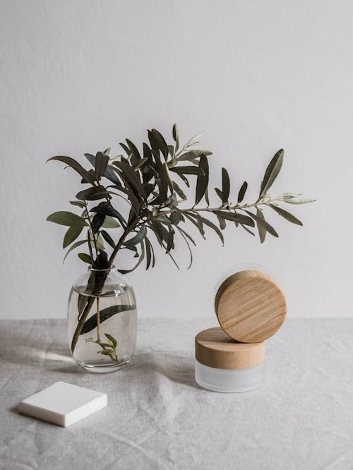 Cosmetic Containers on Gray Textile