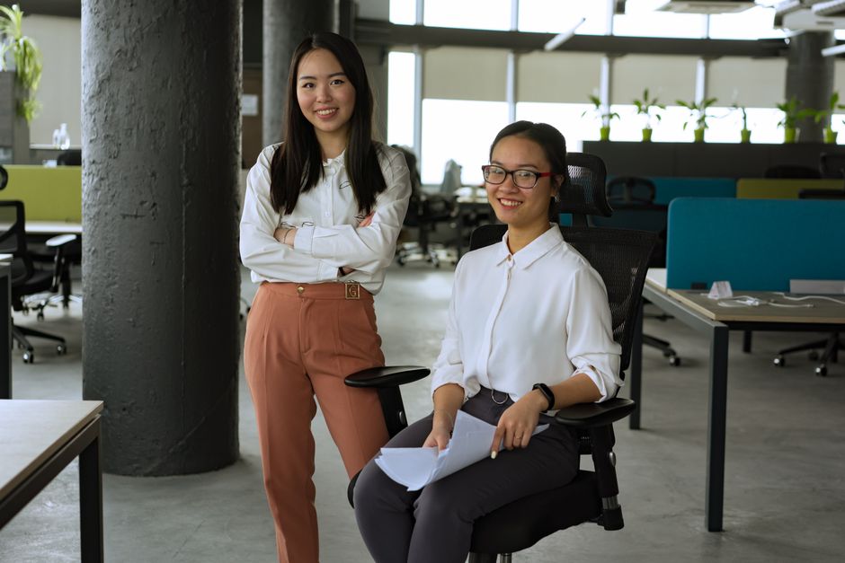 Photo by Mikhail Nilov on Pexels Two women in a contemporary office, smiling and interacting, promoting teamwork and collaboration.