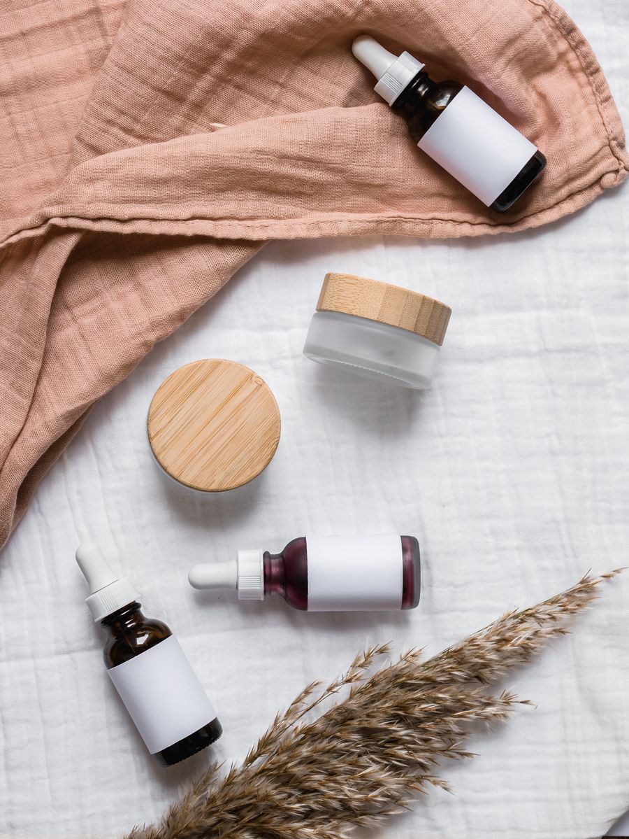 Medical grade skincare bottles on soft fabric