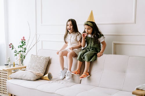 Children sitting on a Sofa