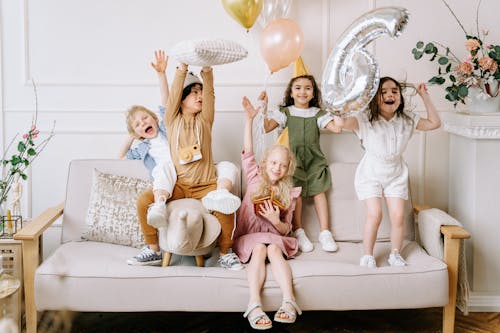 Free Happy Kids on a Sofa  Stock Photo