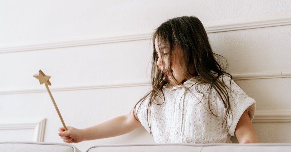Delightful scene of a girl playing with a star-shaped wand, embodying imagination and joy.