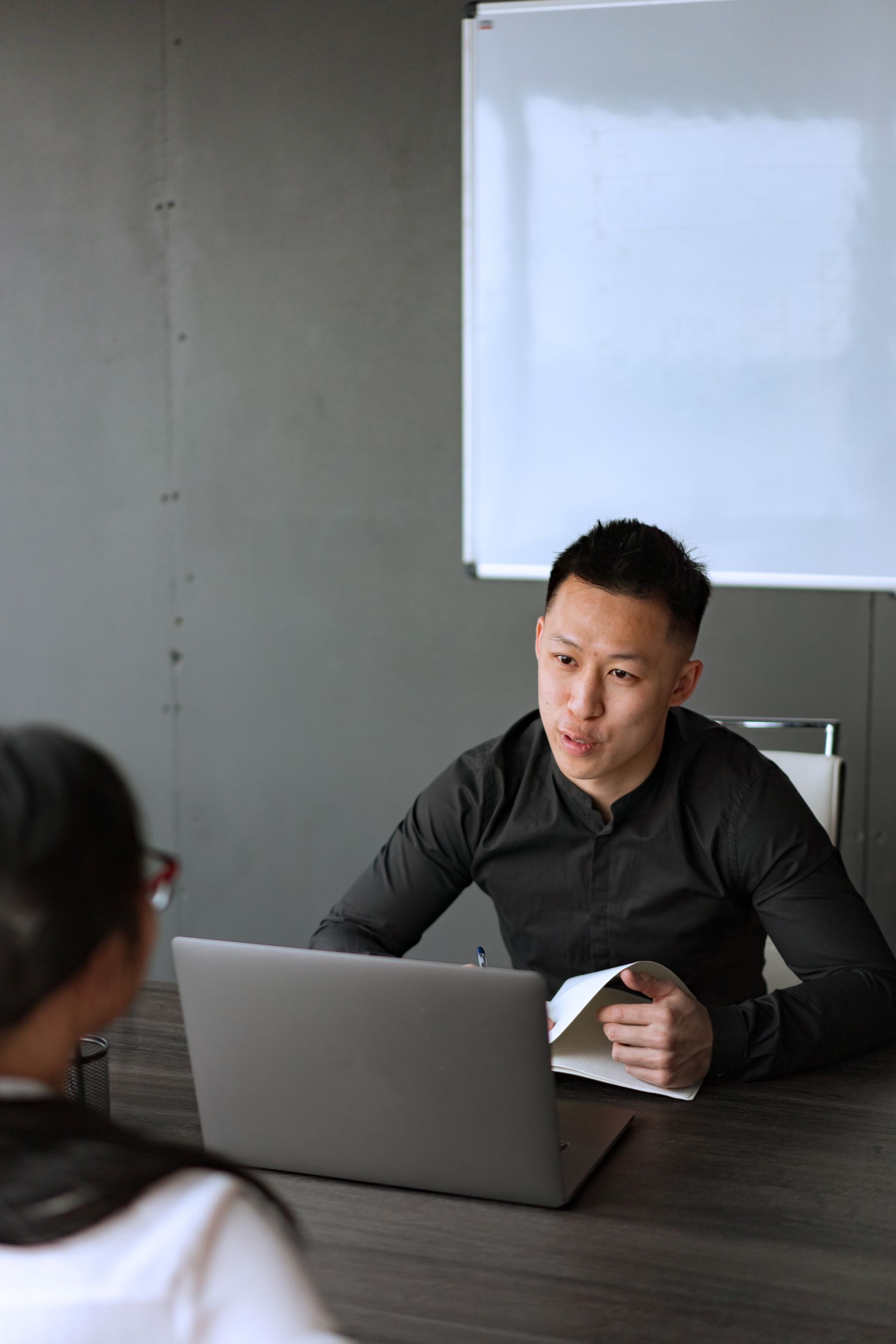 East Asian professional in a career advisory discussion