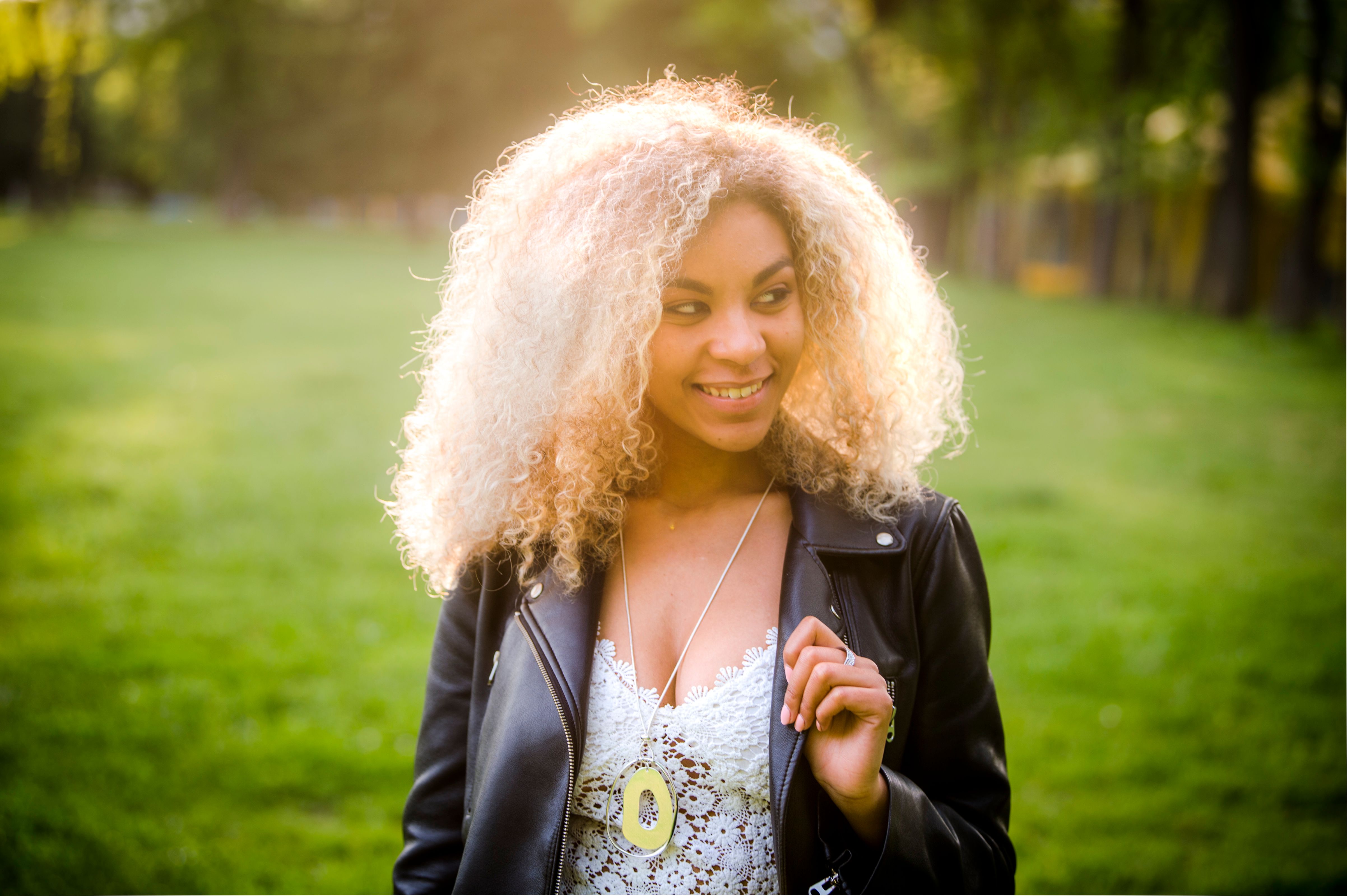 Woman in Black Leather Jacket Smiling · Free Stock Photo