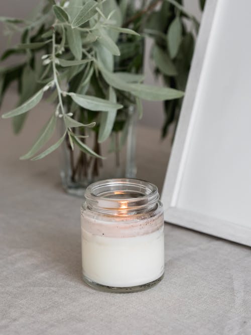 Clear Glass Jar with Lighted Candle