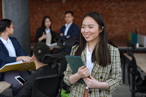 Woman in Green Plaid Blazer Smiling