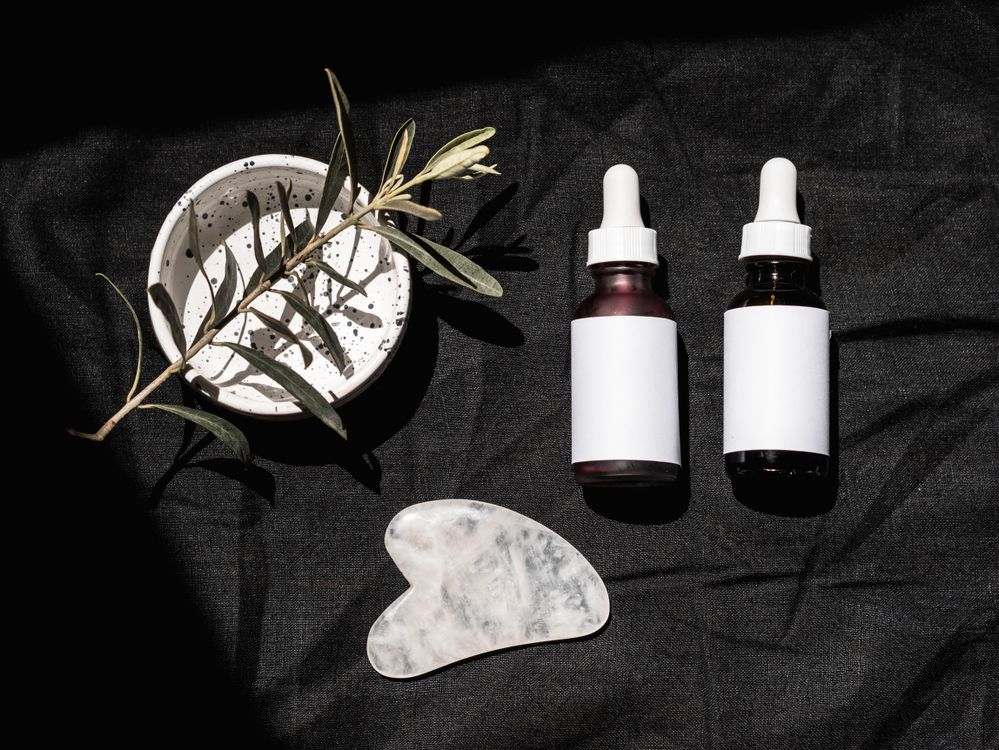 Free Close Up Photo of Bottles on Black Surface Stock Photo
