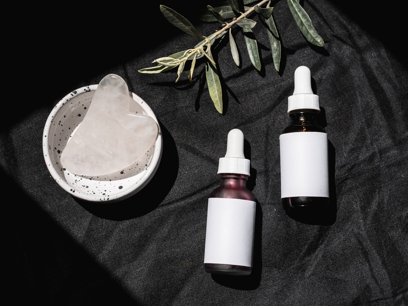Assortment of K-Beauty peptide serum bottles on a minimalist background