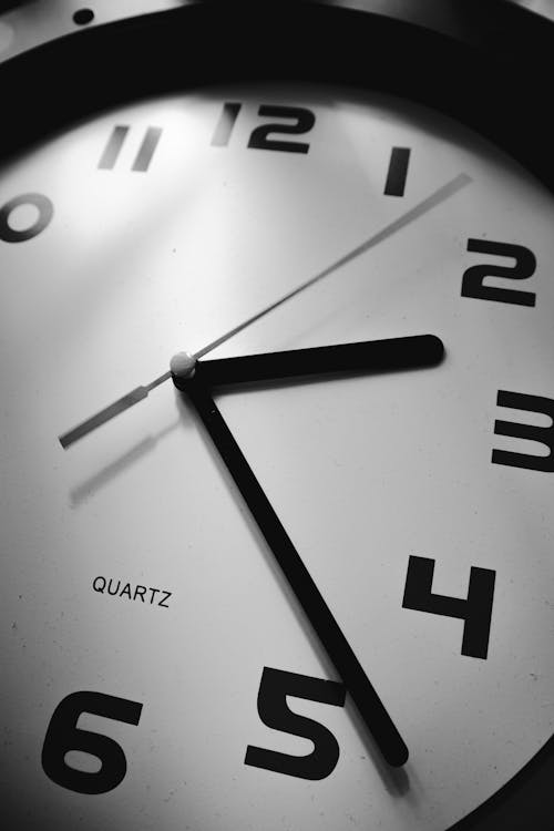 Close Up Photo of Clock In Black and White
