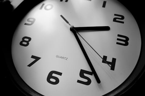 Close Up Photo of Clock In Black and White