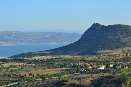 Captivating view of a mountain, lake, and rural landscape in Turkey.