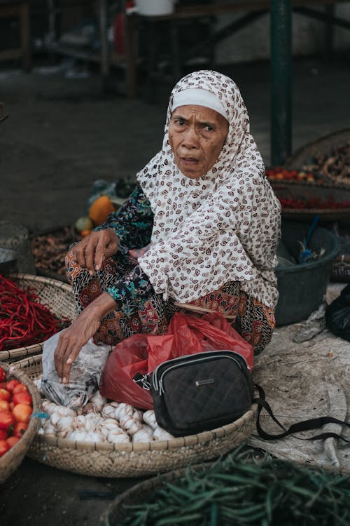 Elderly Woman Selling Vegetables