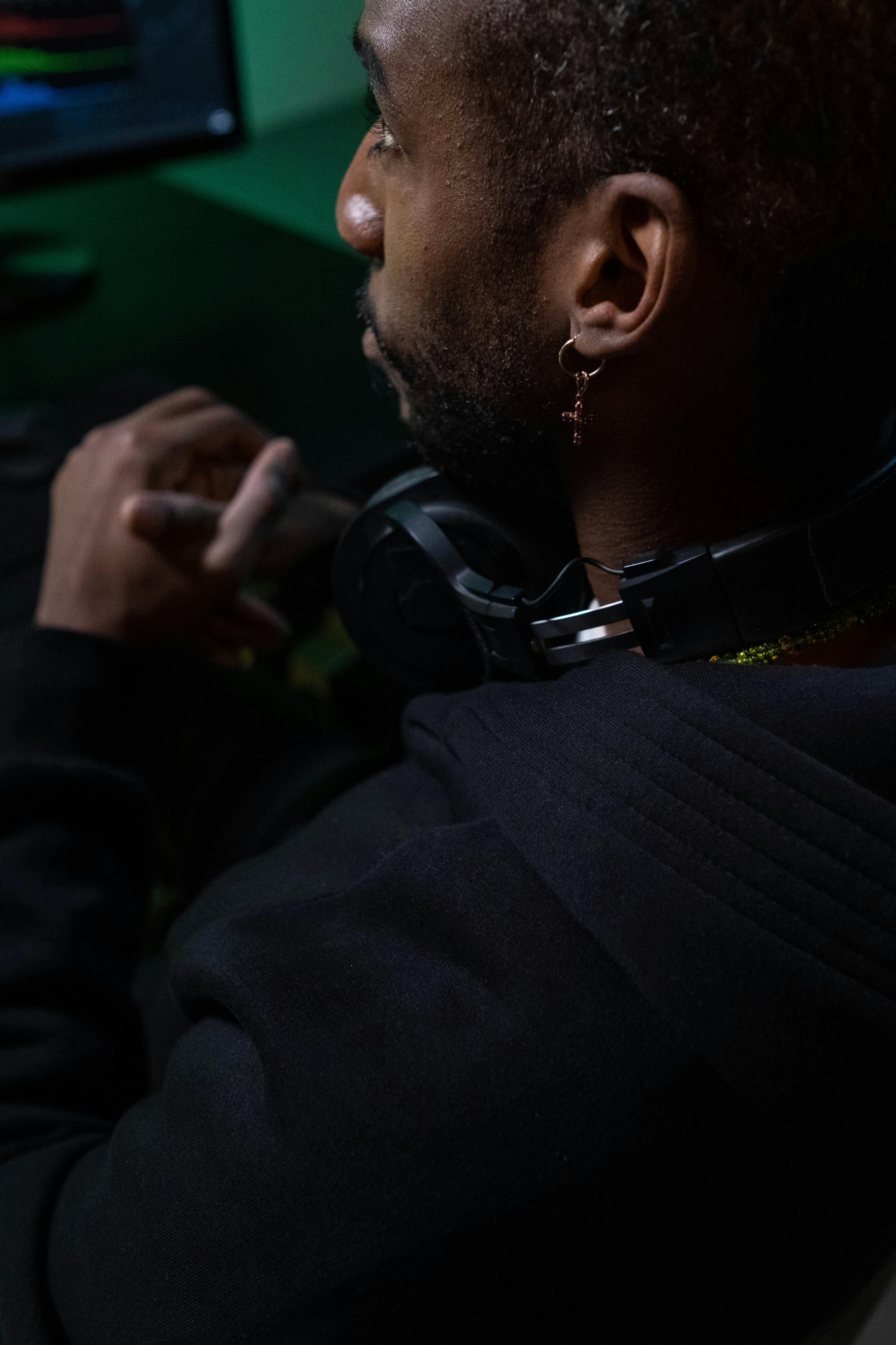 close up shot of a man wearing headphones