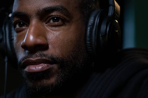 Close-up Shot of a Man wearing Headphones