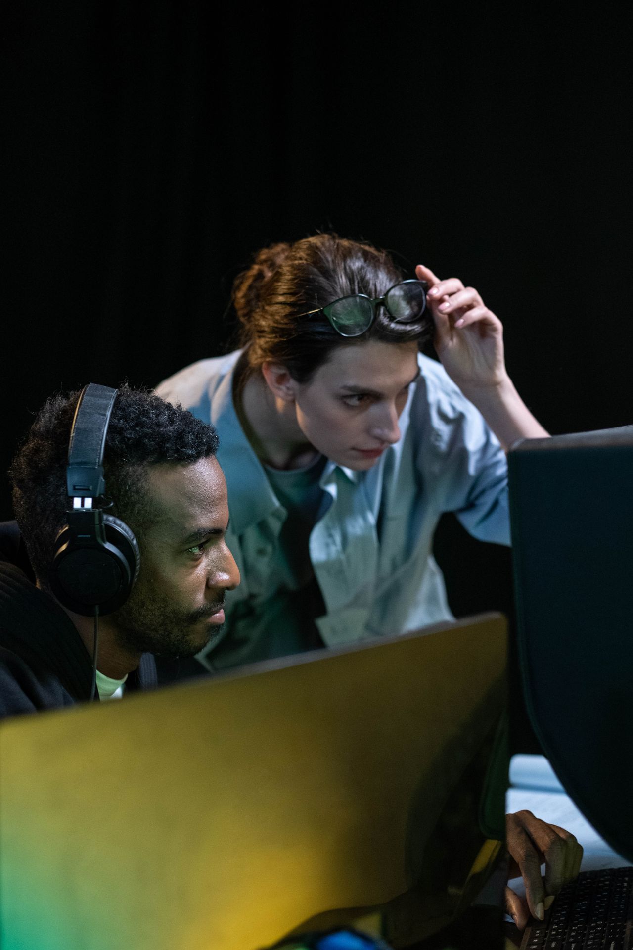 Media professionals collaborating in a real post-production and communication studio