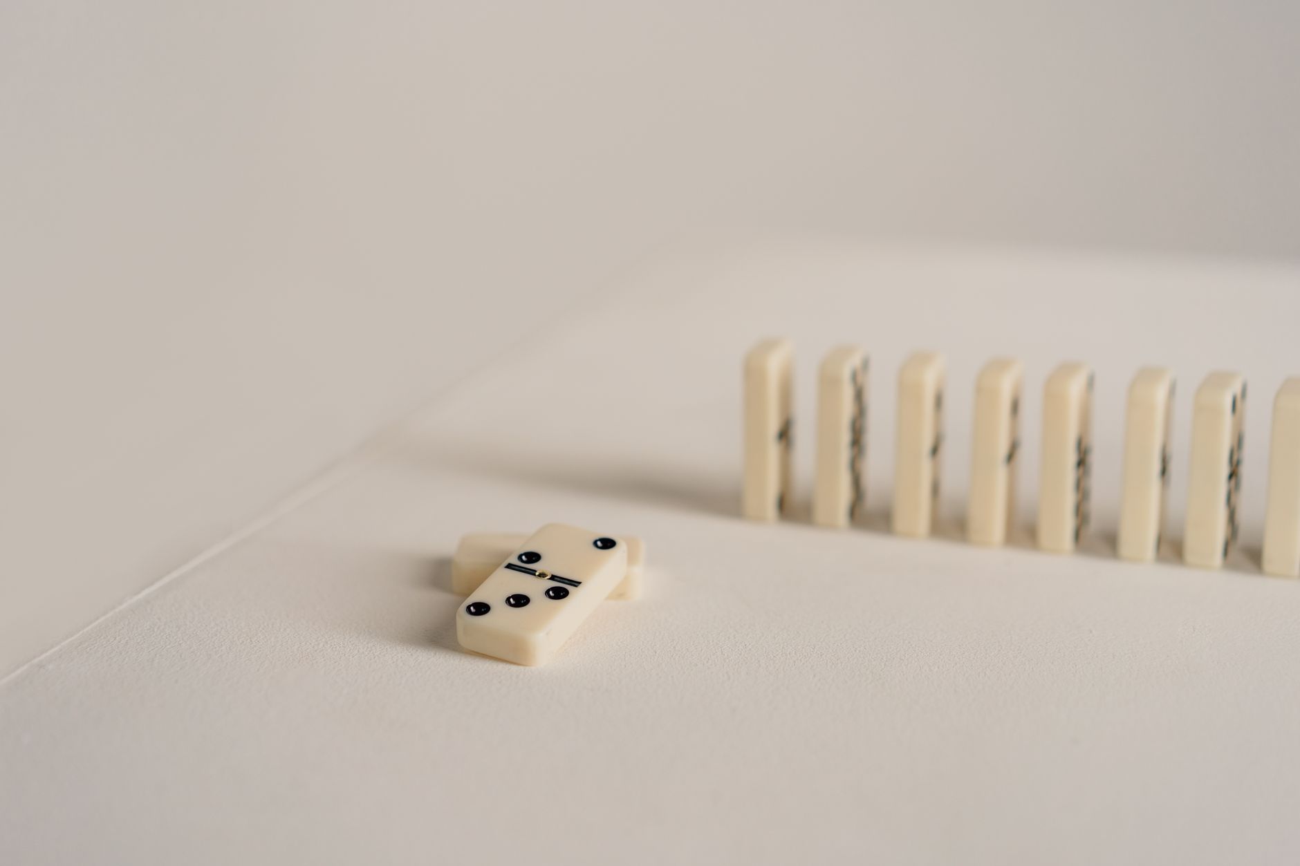 Close-up of domino tiles arranged in a row, highlighting minimalistic game setup.