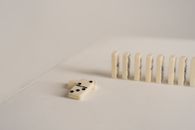 Close-up of domino tiles arranged in a row, highlighting minimalistic game setup.