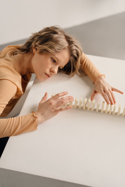 A Woman Looking the Domino