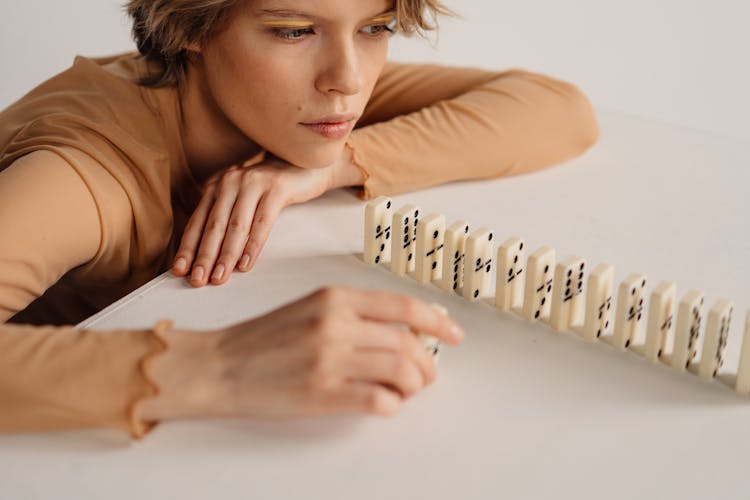 A Woman Looking The Domino