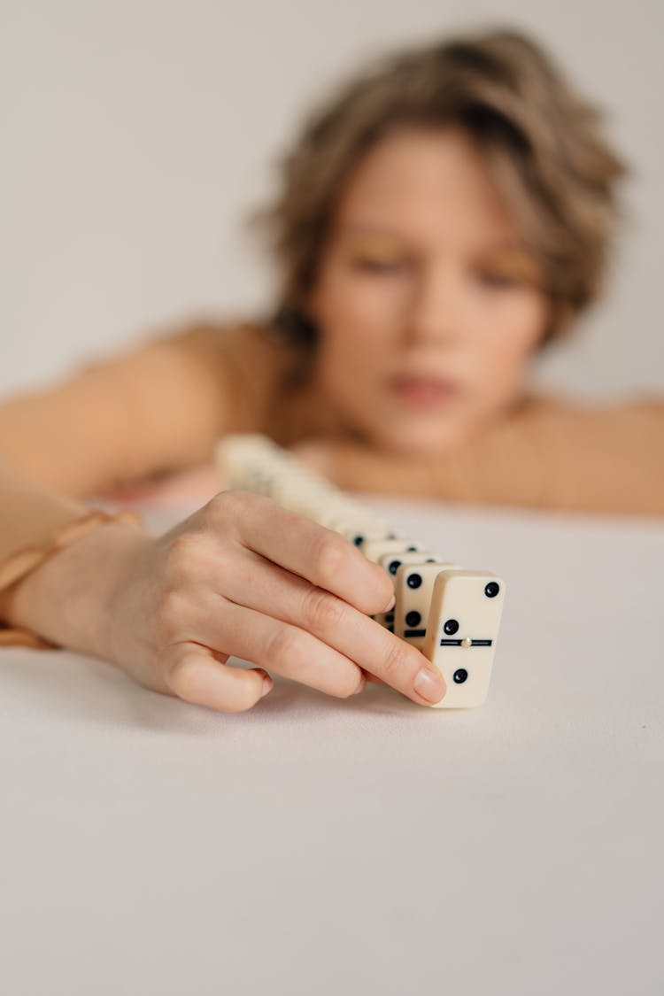 A Woman Playing Domino