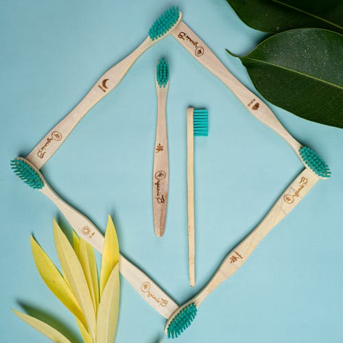 Wooden Toothbrushes on a Flat Surface