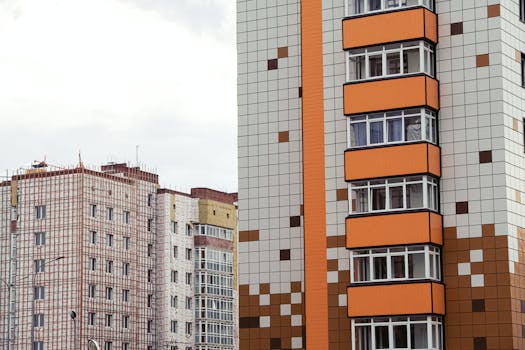 Close-up of modern high-rise apartment buildings with patterned facades.