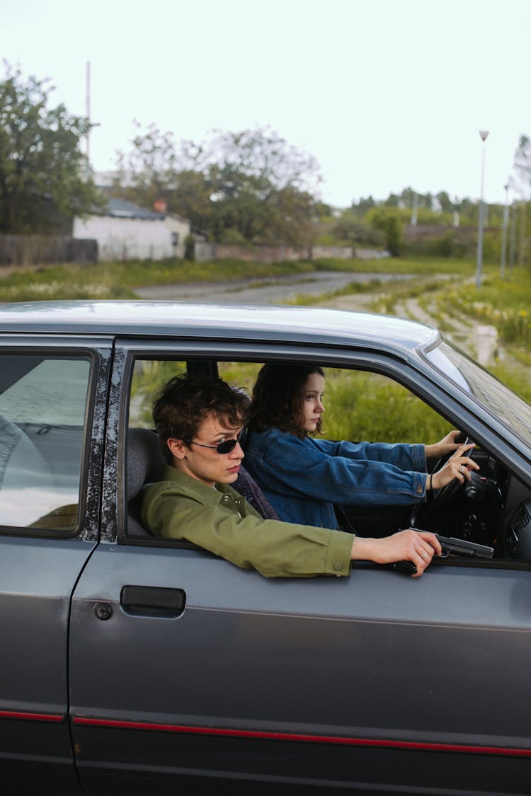 A Man And Woman In The Car