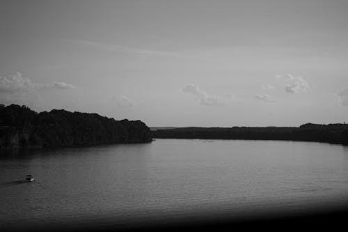 Grayscale Photo of a Wide Lake