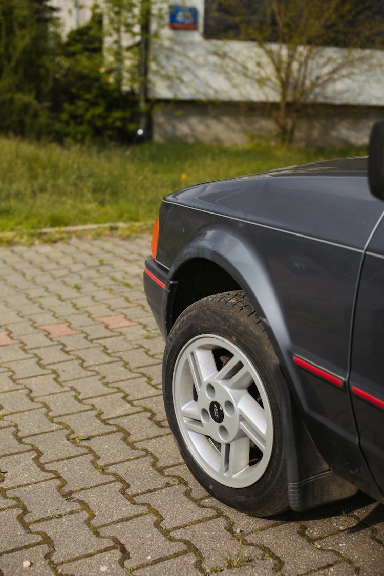 Black Car On Gray Brick Road