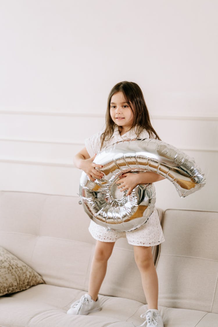 Girl Holding A Balloon