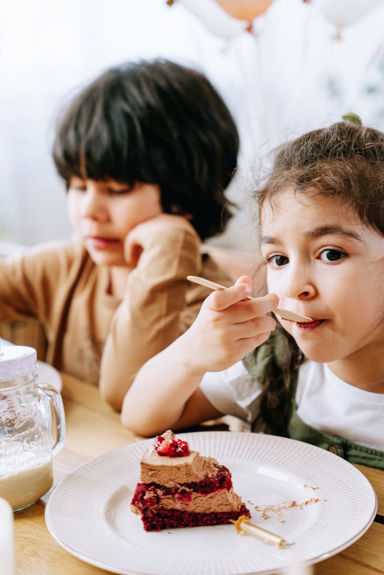 
A Girl Eating A Cake