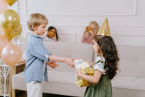 Boy Giving a Present to a Girl