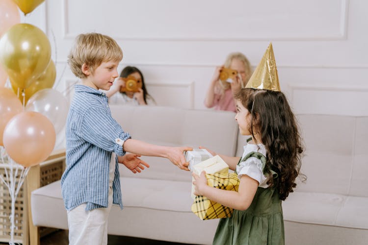 Boy Giving A Present To A Girl