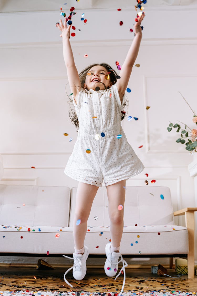 Girl Throwing Confetti In The Air