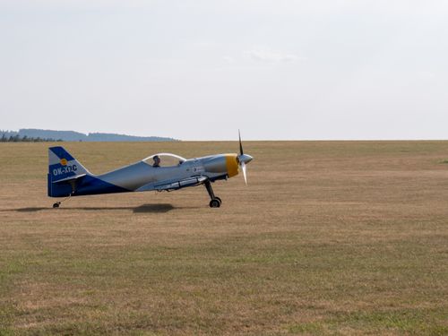 Free A small propeller plane ready for takeoff on a clear day at Rakovník airfield in Czechia. Stock Photo