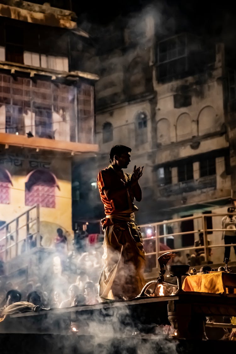 Man Standing On Boat At Night