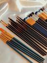 Different Brushes on White Fabric