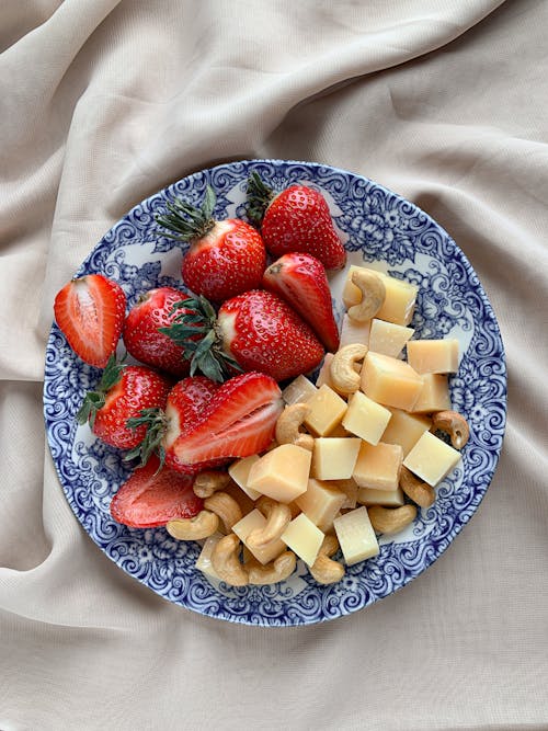 Free A Plate of Strawberries and Cheese Stock Photo