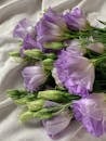 Purple and White Flower on White Textile