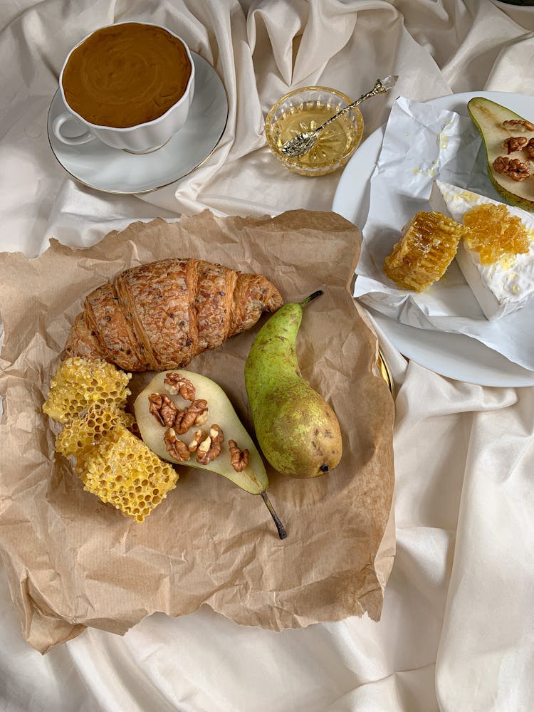 Croissant And Fruits Beside A Dalgona Coffee