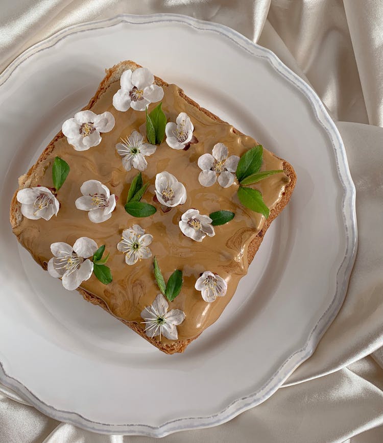 Flowers Petals On Bread With Cream