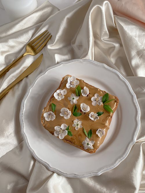 Free Bread with Peanut Butter and Flowers Stock Photo