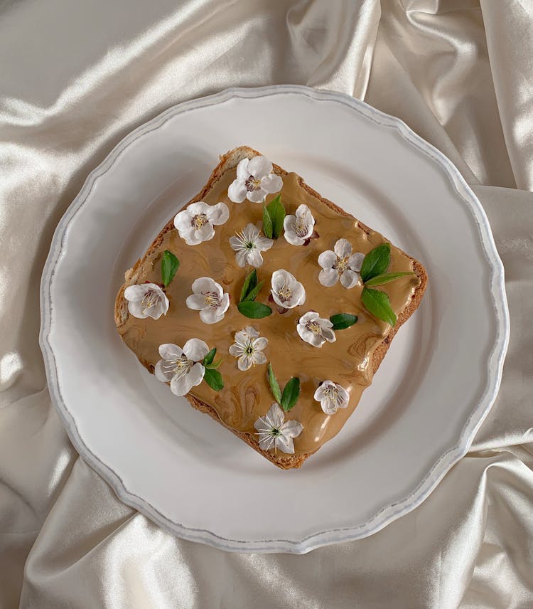 Flowers Petals On Bread On Plate