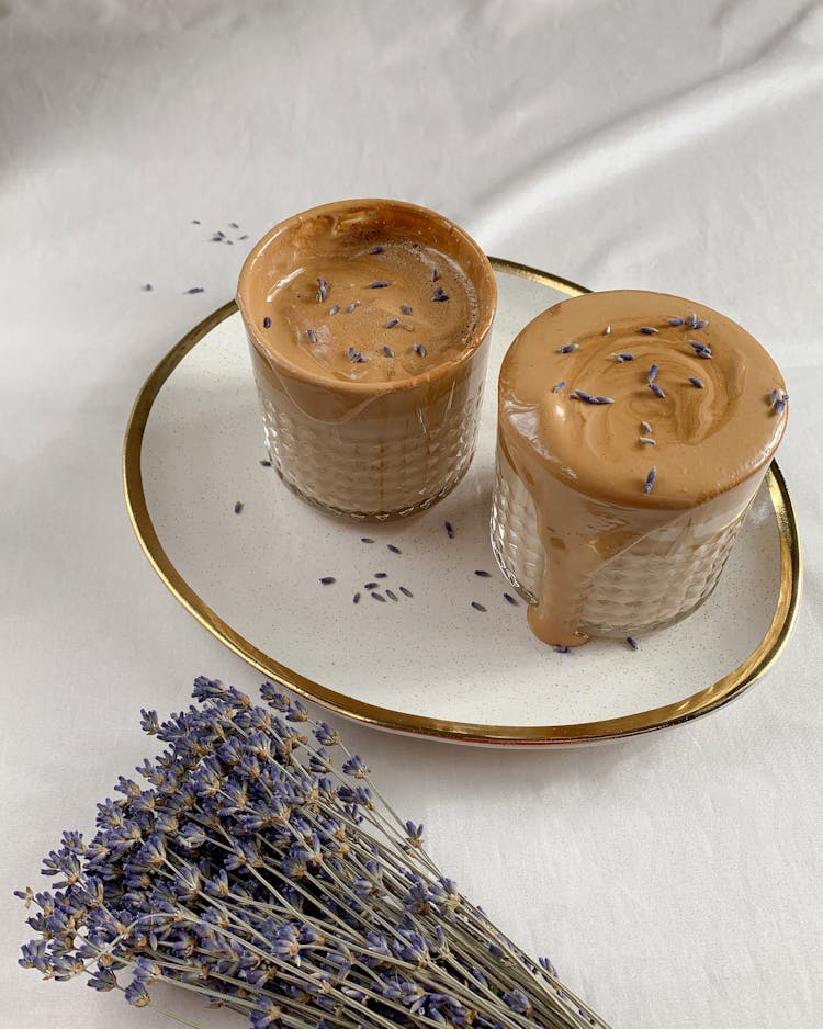 Overflowing Coffee On Glass Cup