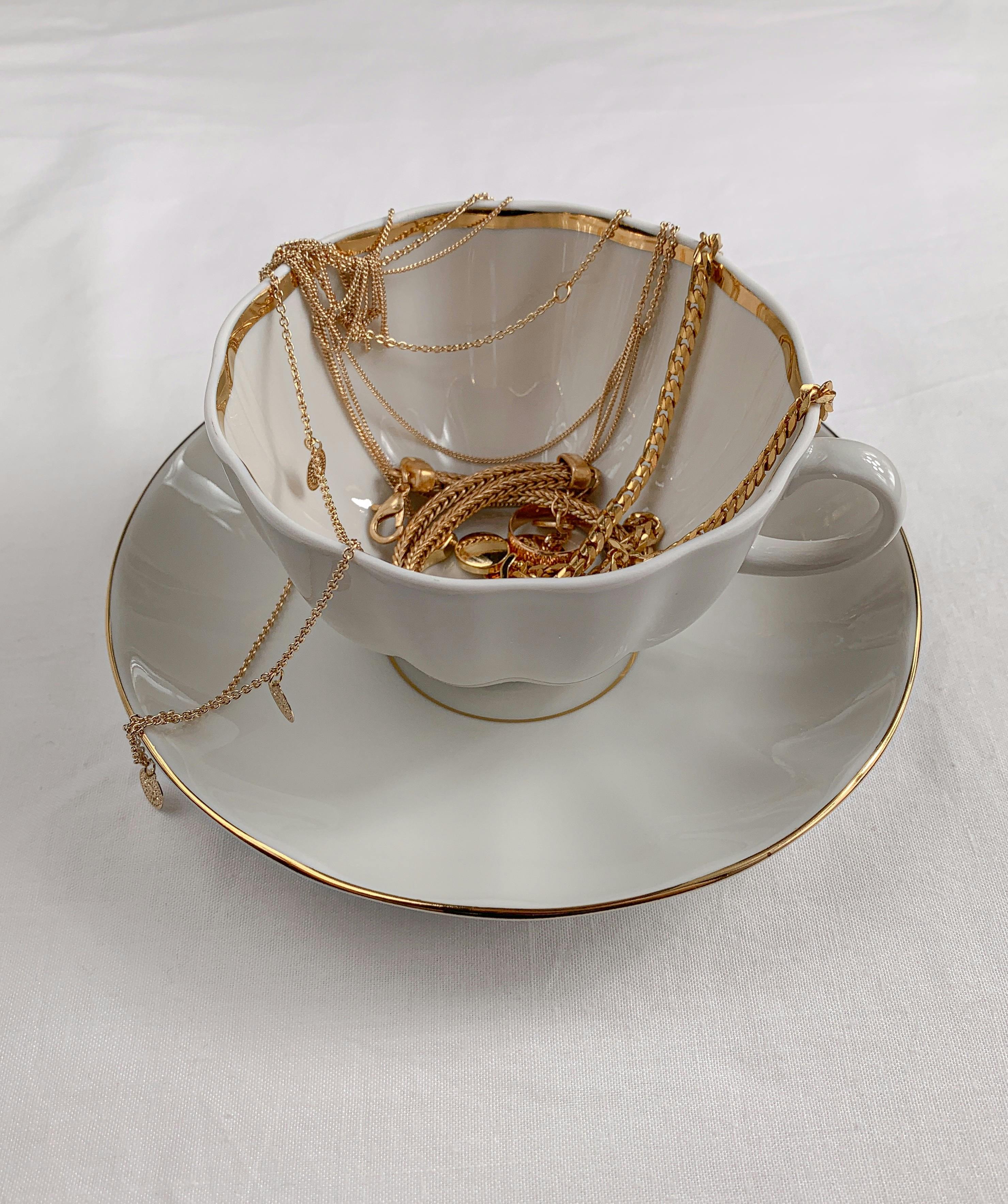 jewelries in a tea cup