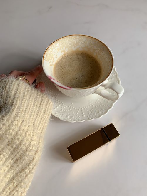 Free Cozy coffee break with a lipstick touch on a marble surface. Stock Photo
