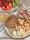 Sliced Bread With Sliced Strawberries and Sliced Fruits on Clear Glass Plate