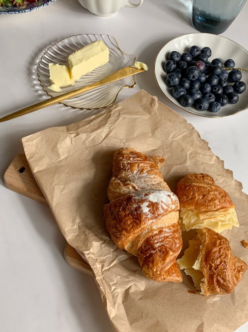 Free Croissants with Butter and Blueberries Stock Photo