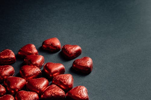 Red Heart Shaped Candies on Gray Background